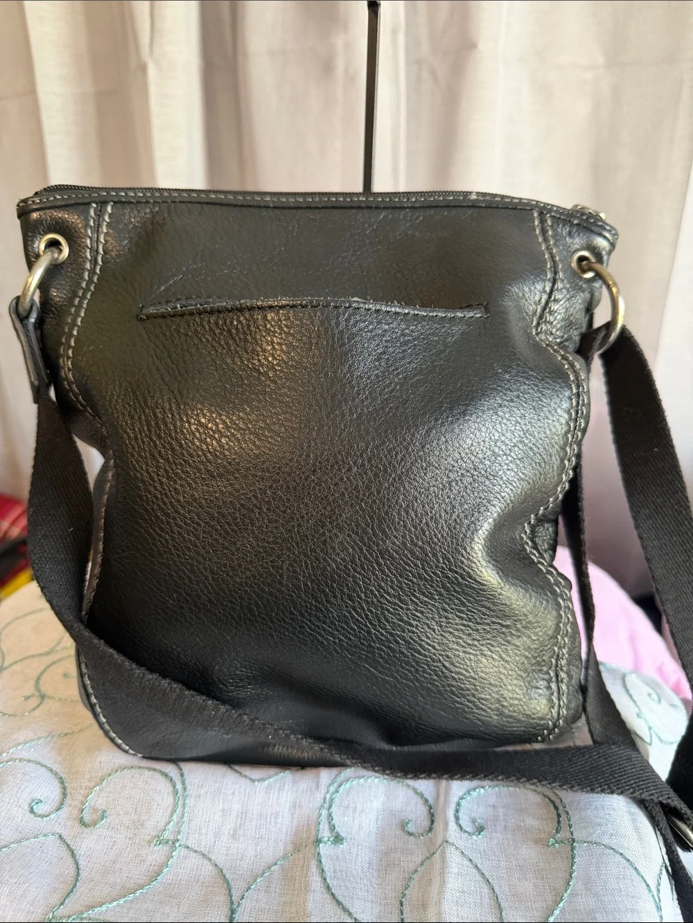 The Sak Black Pebbled Leather Messenger Bag with Fabric Strap